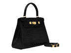 A large black, ‘croc’ print Italian calf leather handbag with top handle, detachable strap and gold plated hardware.