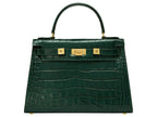 A large dark green ‘croc’ print Italian calf leather handbag with top handle, detachable strap and gold plated hardware