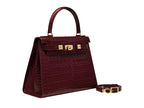 A large wine ‘croc’ print Italian calf leather handbag with top handle, detachable strap and gold plated hardware with magnetic fastening.