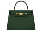 A large dark green pebble print Italian calf leather handbag with top handle, detachable strap and gold plated hardware