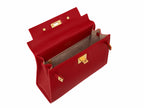 Inside of a red Italian natural print leather handbag with a top handle and a detachable shoulder strap, featuring gold-plated hardware and magnetic locks.
