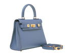 A blue grainy print Italian calf leather handbag with gold plated hardware, a top handle, and a detachable shoulder strap.