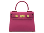 A bright pink, medium-sized, grainy print Italian calf leather handbag with gold-plated hardware, detachable strap and a top handle.