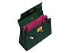 Green handbag with pink interior and gold accents on a white background