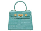 A turquoise 'Croc' print Italian calf leather handbag with gold plated hardware and a top handle.