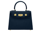 Navy blue Italian leather handbag with gold hardware, a top handle and a detachable strap on a white background