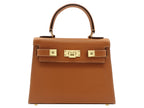 A tan-colored, pebble print Italian calf leather handbag with gold-plated hardware, a top handle and a detachable strap.