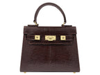 Brown textured ‘lizard’ print Italian leather handbag with gold hardware on a white background