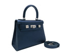 Medium navy blue natural grain Italian leather handbag with a hint of silver sparkle with silver hardware, a top handle and a detachable strap on a white background