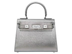 Medium silver natural grain Italian leather handbag with silver hardware, a top handle and a detachable strap on a white background