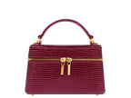 Maroon ‘lizard’ print Italian leather handbag with gold zipped closure and gold accents on a white background