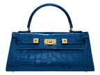 A cobalt blue 'Croc' print Italian calf leather handbag with gold plated hardware and a top handle.