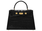 A large black, ‘croc’ print Italian calf leather handbag with top handle, detachable strap and gold plated hardware.