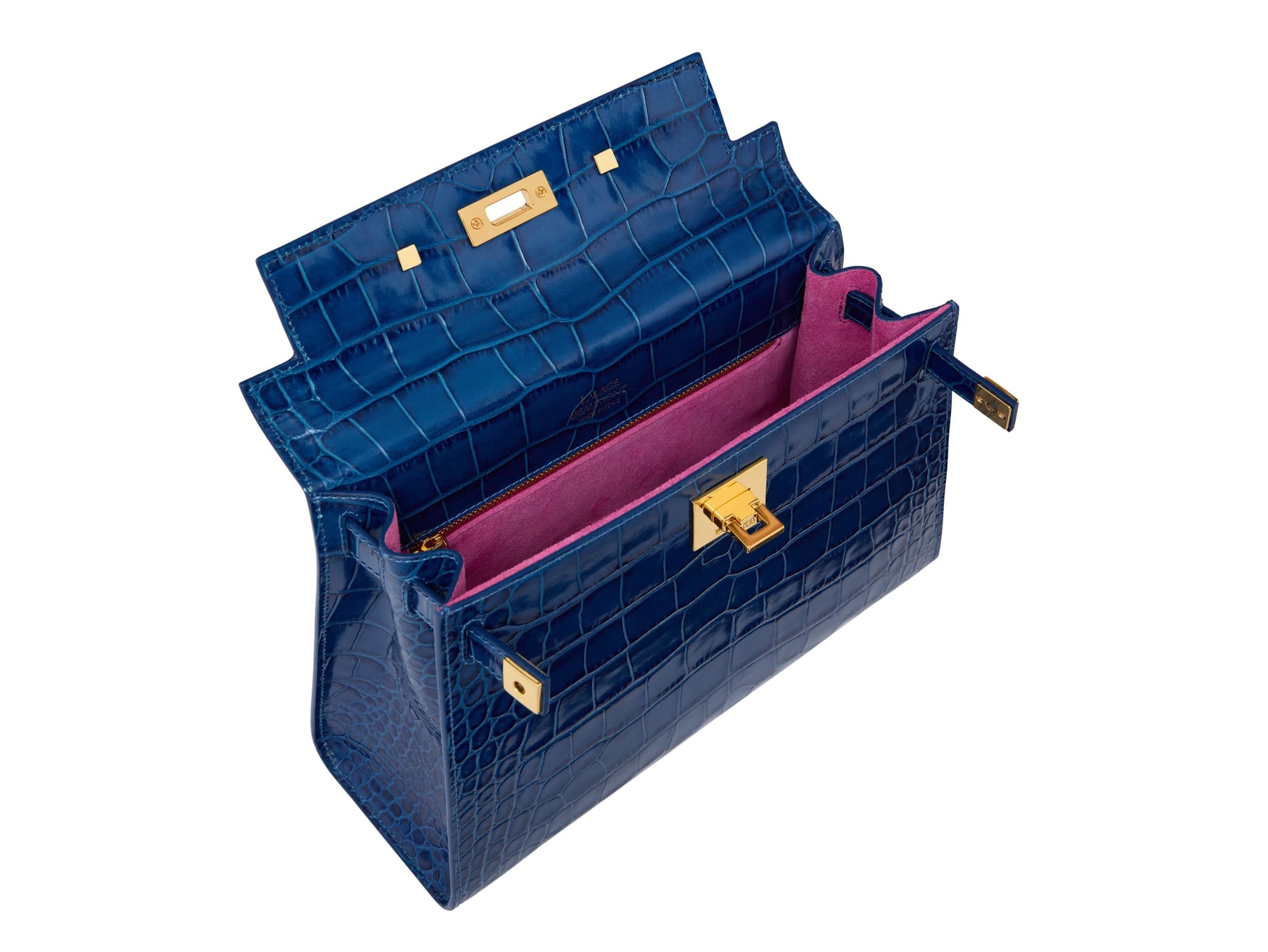 Inside a large cobalt blue ‘croc’ print Italian calf leather handbag with top handle, detachable strap and gold plated hardware featuring the bright pink suede lined interior