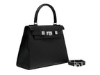 A black Maya Large Italian leather handbag with a pebble print, featuring a top handle, detachable strap and silver colored hardware.