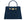 A large navy Italian leather, natural print handbag with gold hardware, a top handle with a detachable strap on a white background.