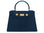 A large navy Italian leather, natural print handbag with gold hardware, a top handle with a detachable strap on a white background.