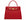 A red Italian natural print leather handbag with a top handle and a detachable shoulder strap, featuring gold-plated hardware and magnetic locks.