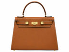 A large tan pebble print Italian calf leather handbag with top handle, detachable strap and gold plated hardware