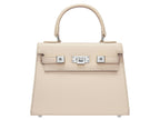 A medium-sized luxury Italian leather handbag in a soft beige color with a grainy texture, featuring a top handle, a detachable shoulder strap and gold-plated hardware