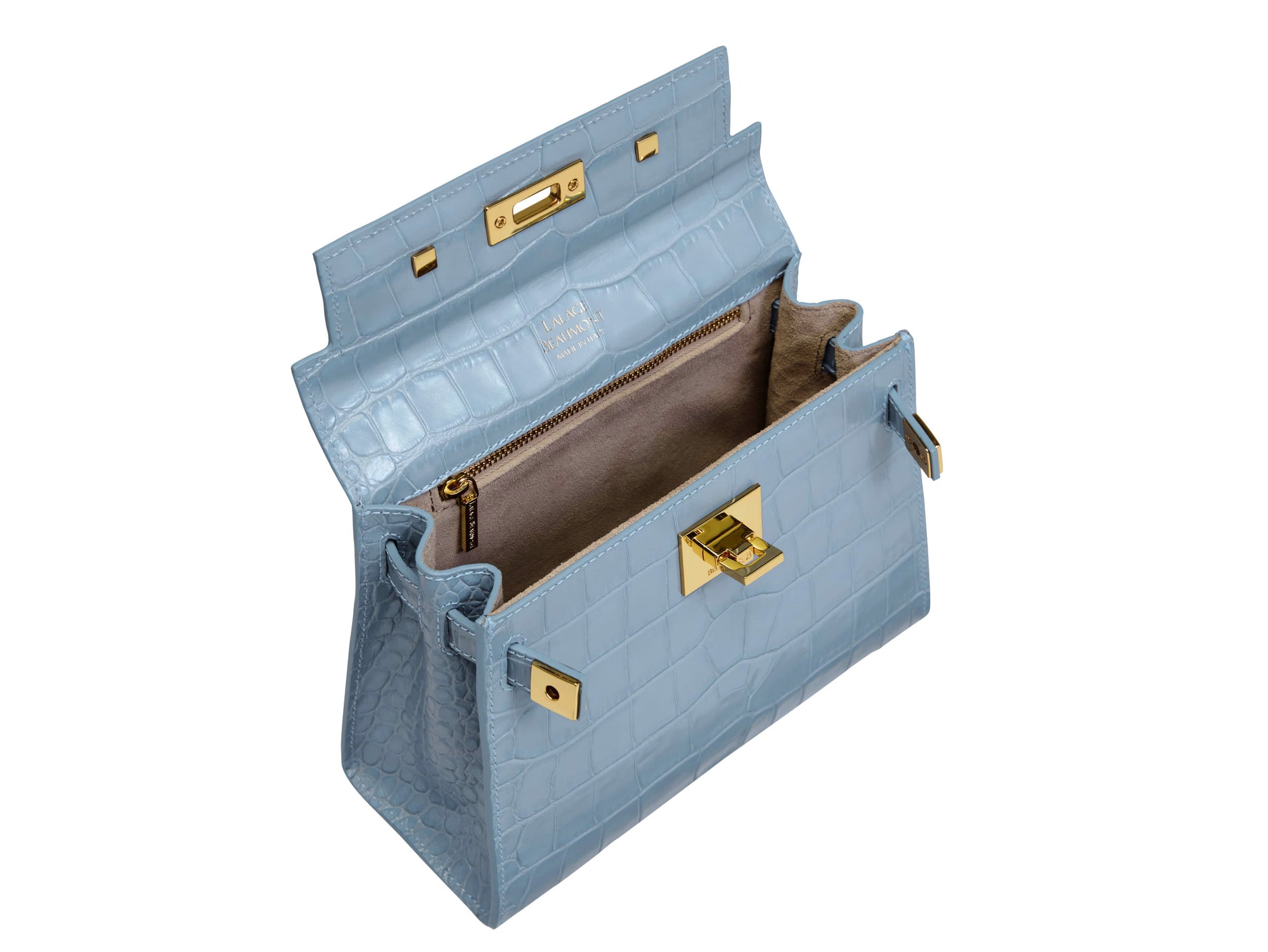Inside view of a blue 'Croc' print Italian calf leather handbag with gold plated hardware, a top handle and a detachable strap.