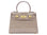 Stone coloured handbag with gold hardware on a white background