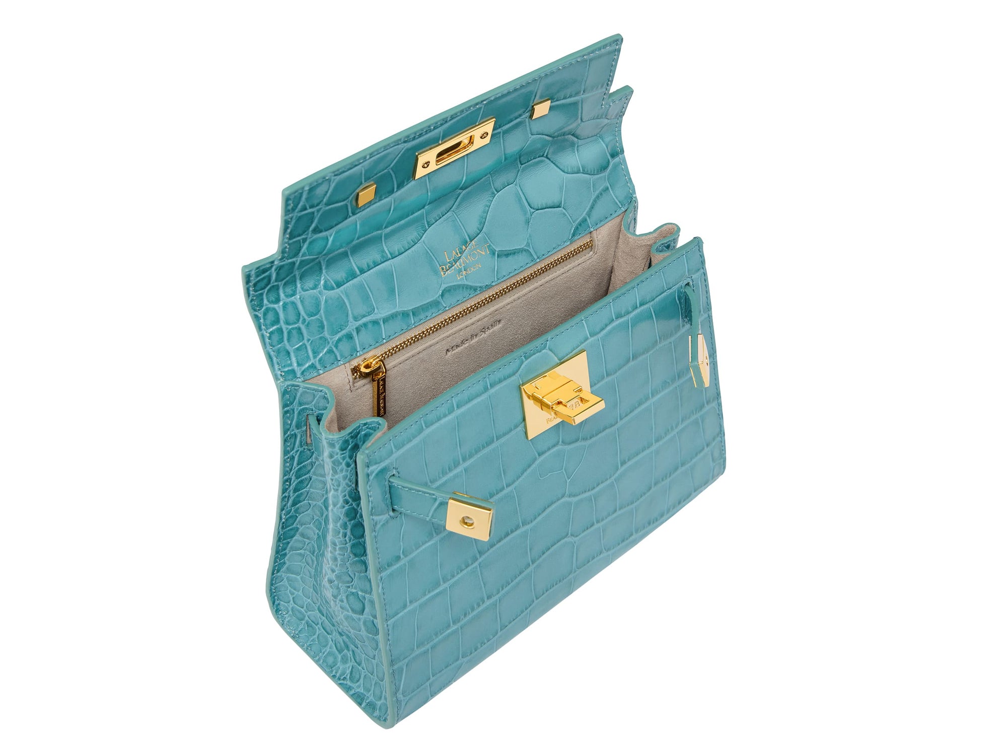 Inside view of a turquoise 'Croc' print Italian calf leather handbag with gold plated hardware and a top handle.