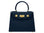 Navy blue Italian leather handbag with gold hardware, a top handle and a detachable strap on a white background