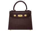 Medium chocolate brown Italian leather handbag with gold hardware, a top handle and a detachable strap on a white background