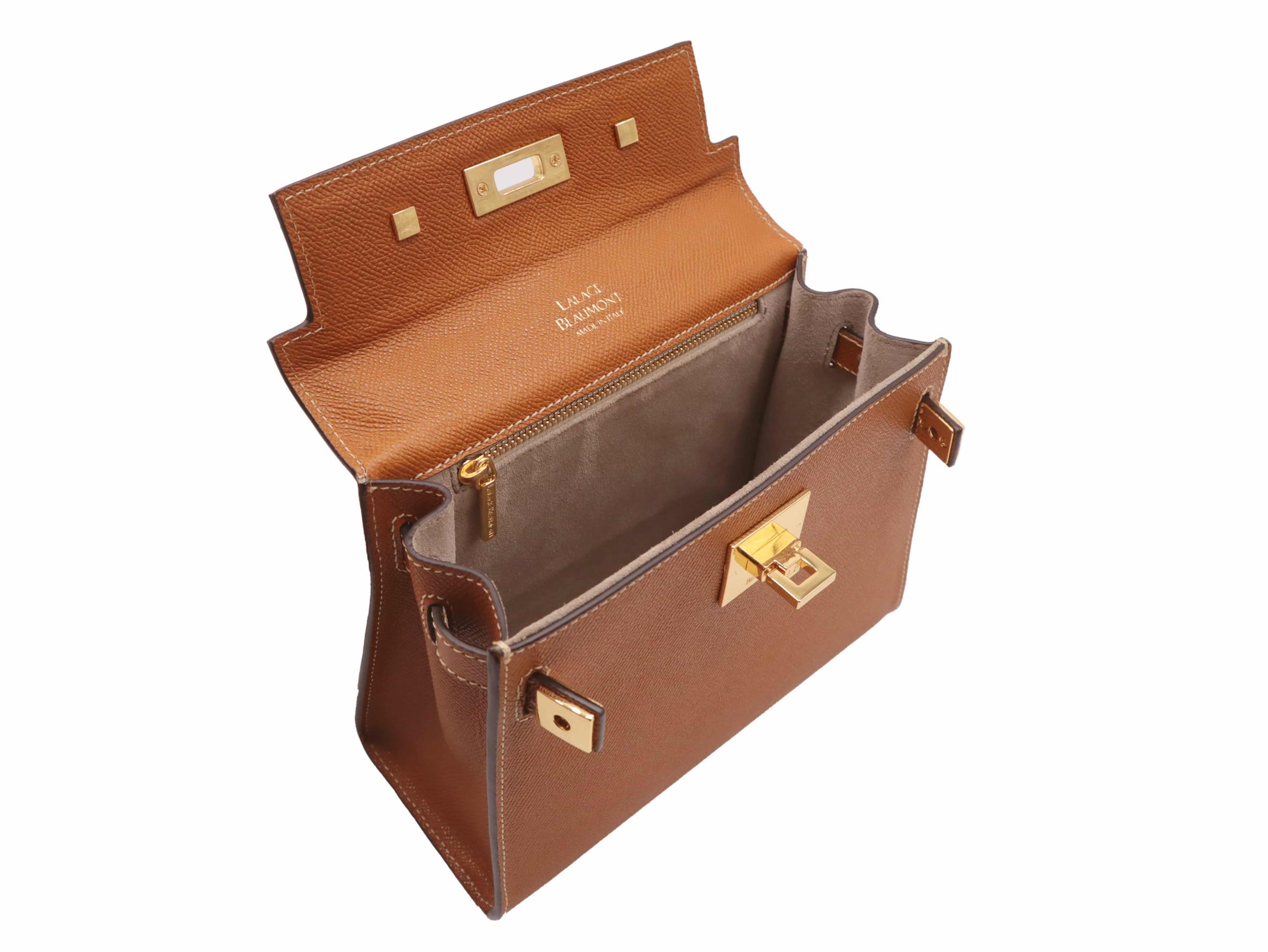 Inside view of a tan-colored, pebble print Italian calf leather handbag with gold-plated hardware, a top handle and a detachable strap.