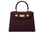 A burgundy wine coloured, medium-sized Italian leather handbag with a pebble print and gold plated hardware, featuring a top handle and a detachable shoulder strap.