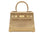 Medium gold natural grain Italian leather handbag with gold hardware, a top handle and a detachable strap on a white background