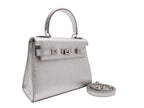 Medium silver natural grain Italian leather handbag with silver hardware, a top handle and a detachable strap on a white background